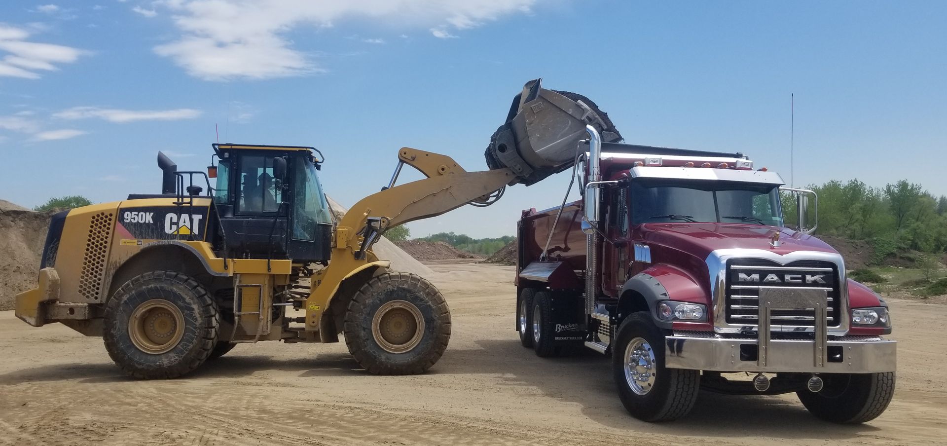 Coal Creek loader and dump truck on a jobsite